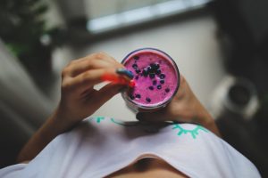Woman drinking an acai smoothie